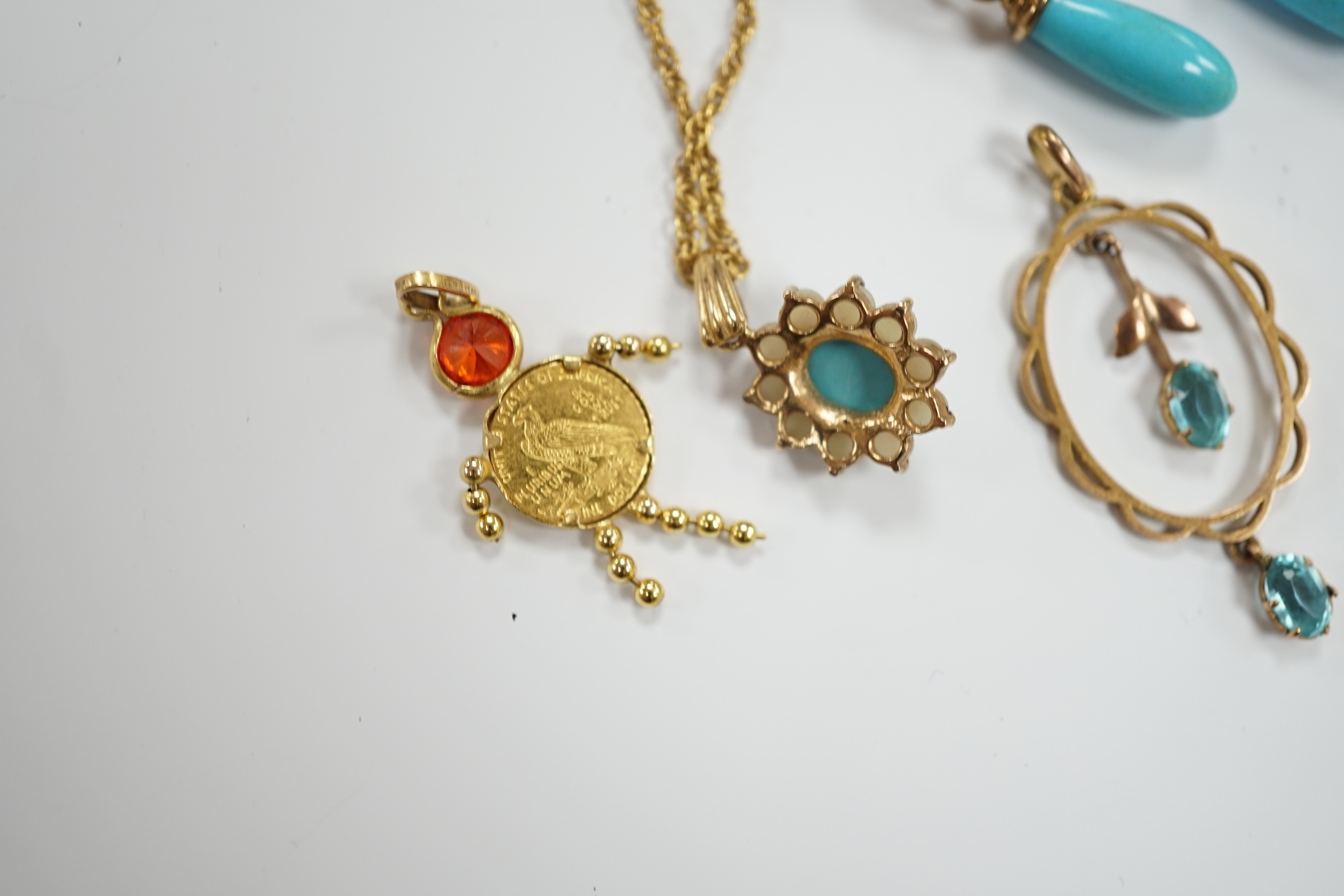 A modern 9ct gold, turquoise and seed pearl cluster set pendant necklace, a pair of 9ct gold and turquoise set drop earrings and two yellow metal pendants, gross weight 9.7 grams.